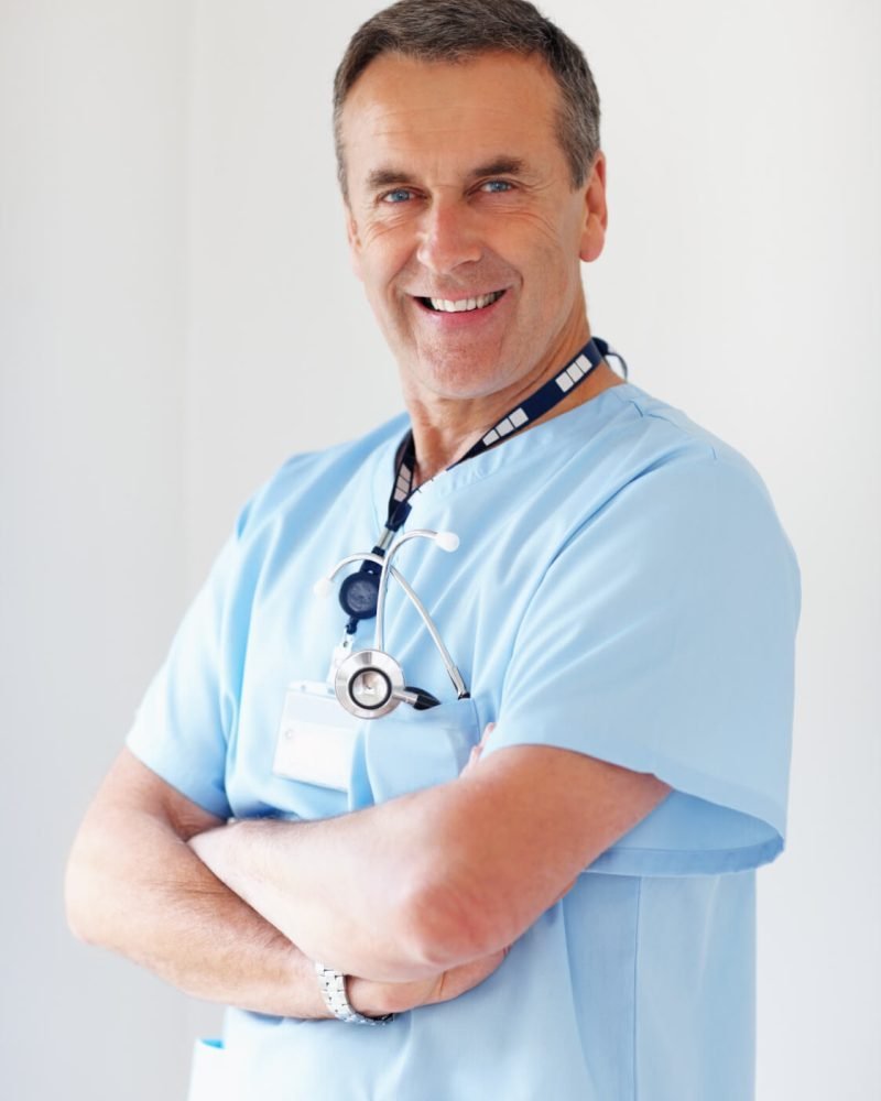 portrait-of-a-smiling-medical-doctor-with-hands-fo-VL9HDF7.jpg